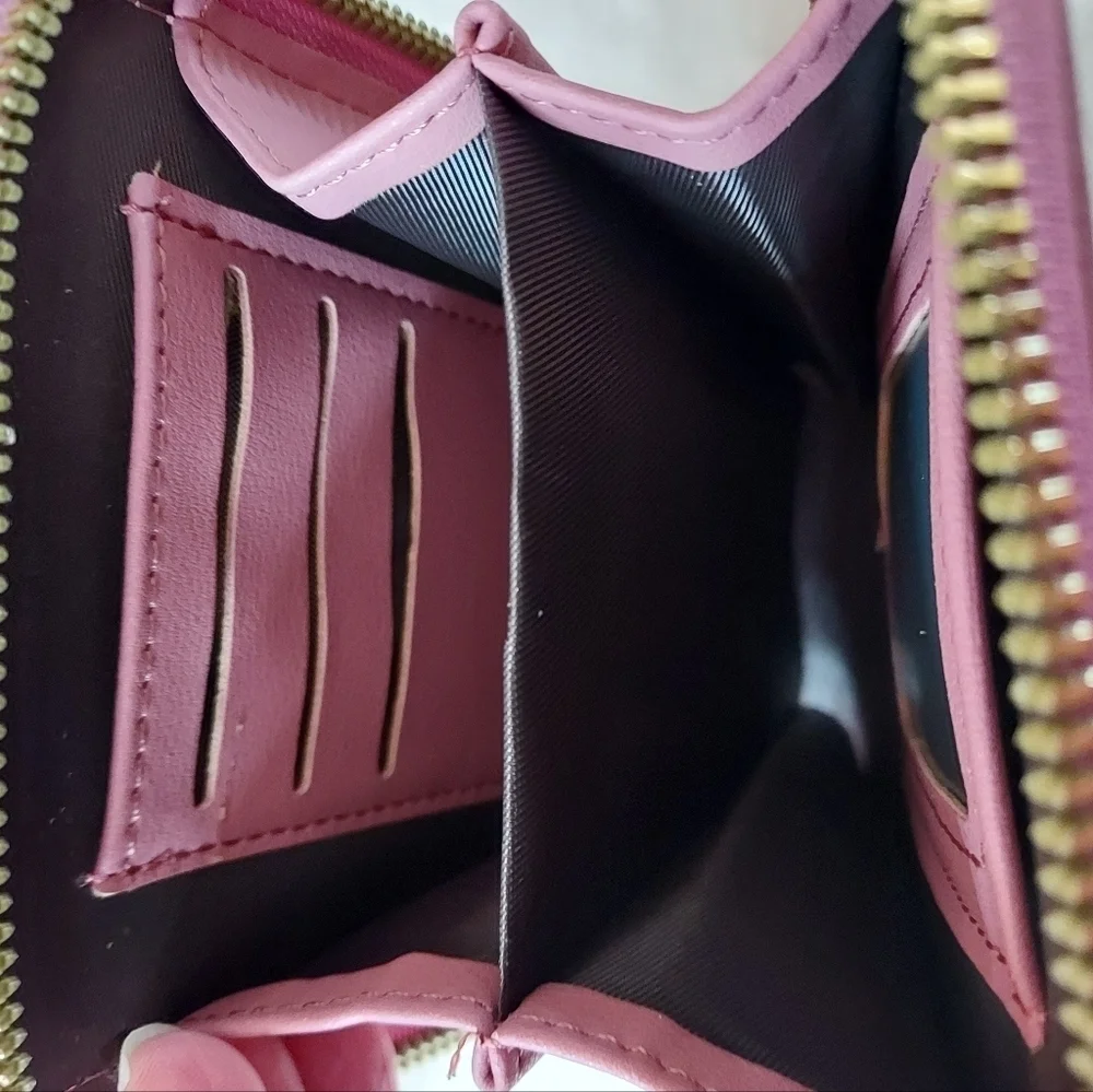 Roulens over shoulder or clutch wallet with cell phone holder.